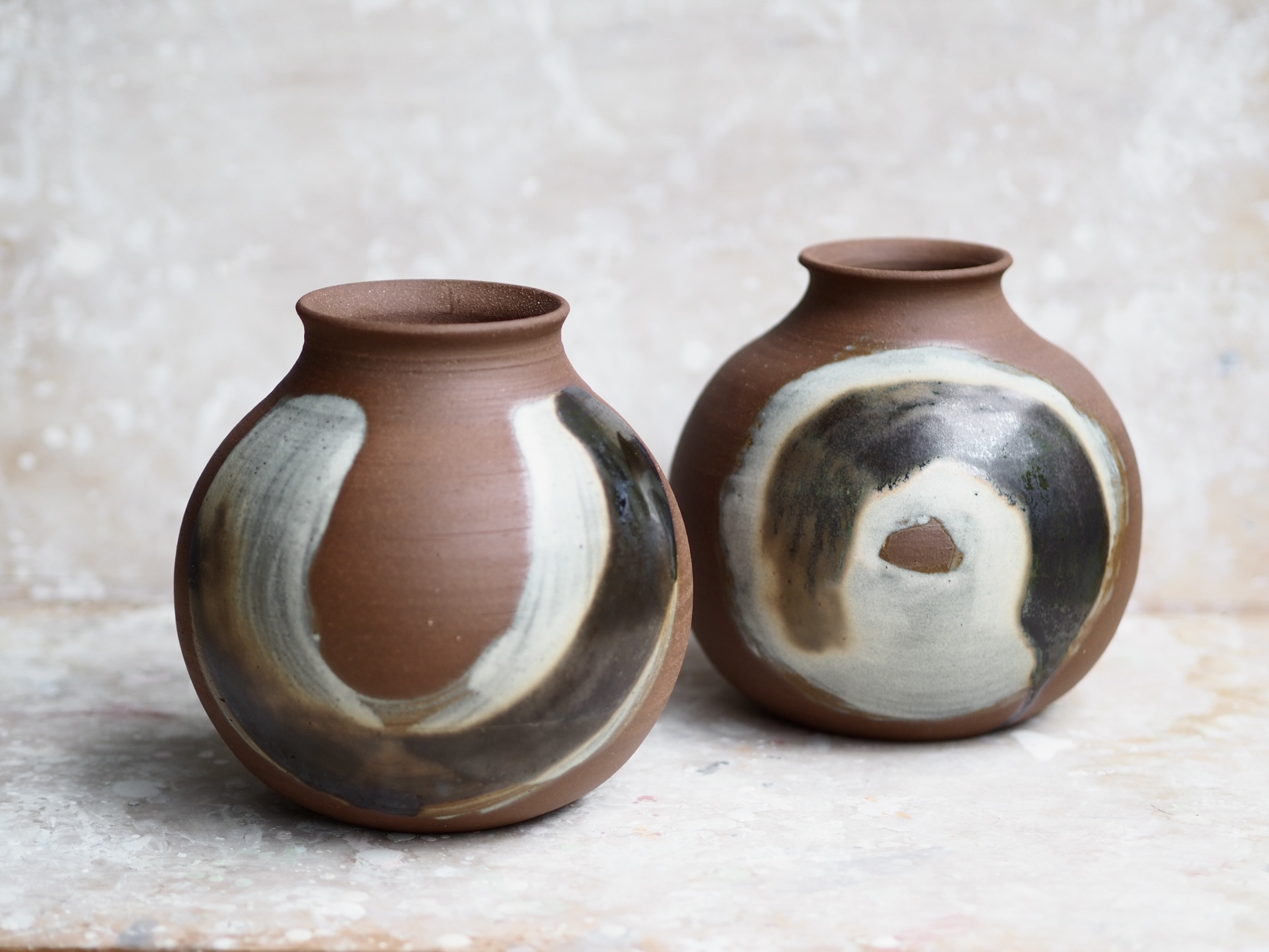 Round red earth vase