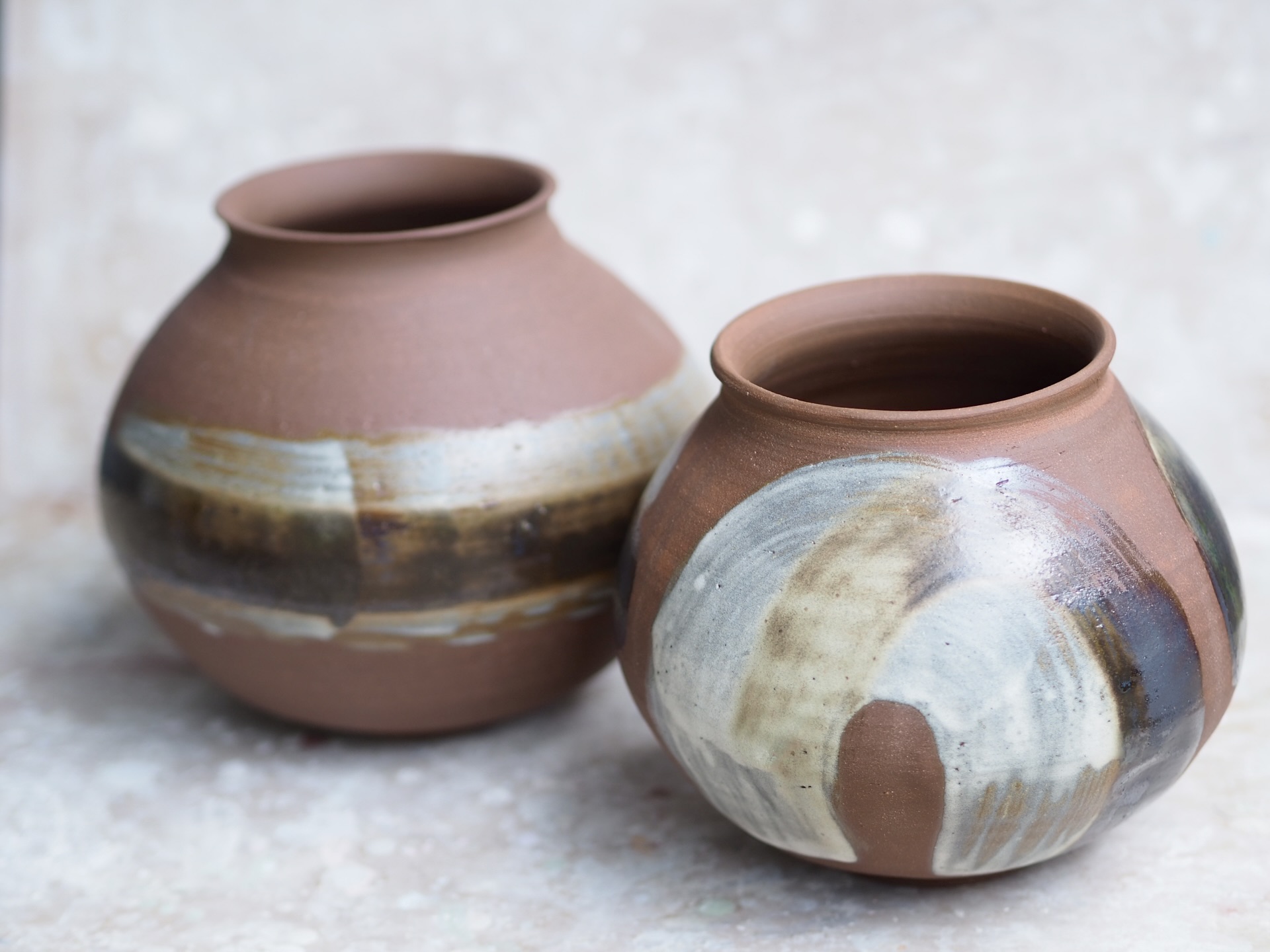 Round red earth vase